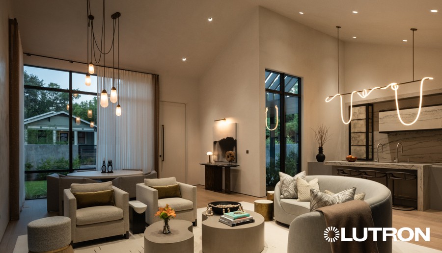 A modern home’s living room with a warmly-lit lighting design.