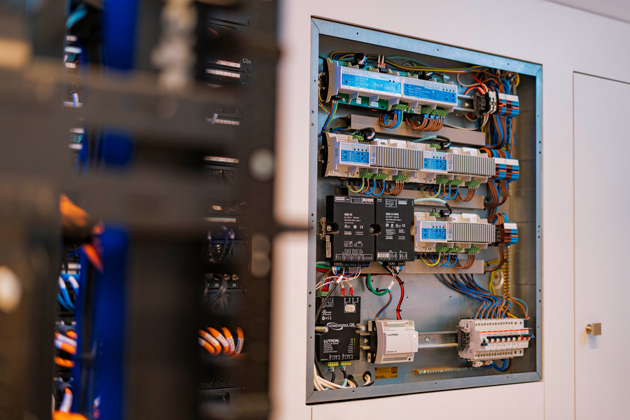 Hidden wiring and equipment rack in a home theater.